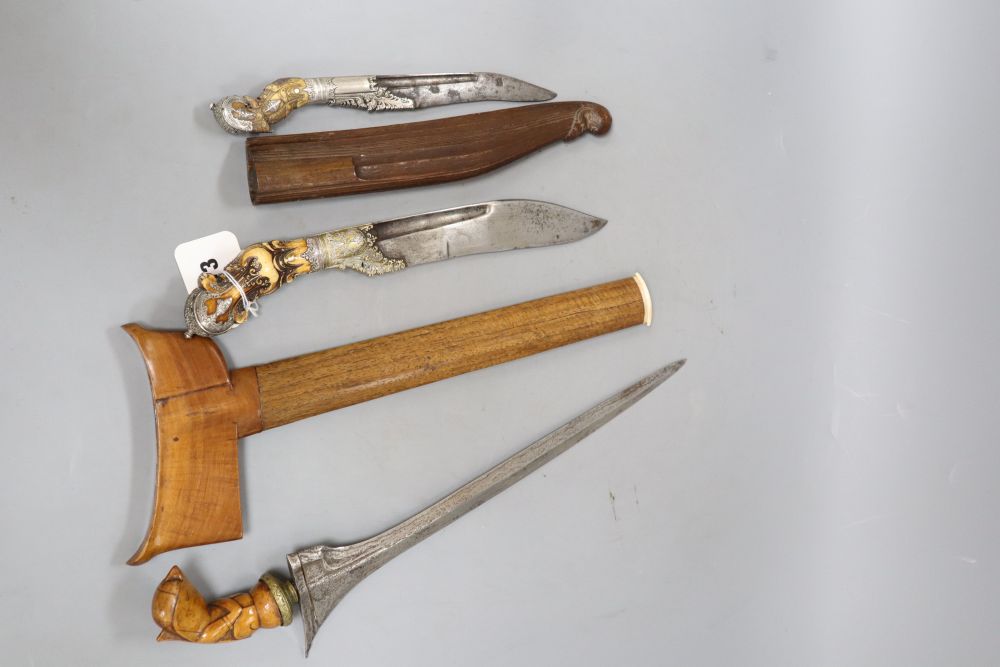 Two Ceylonese knives Pia Kaetta, both with ivory grips and silver mounts and a Malayan dagger kris (3)